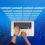 Person typing on a laptop with the word "content" repeated, symbolizing digital content creation and online news hub.